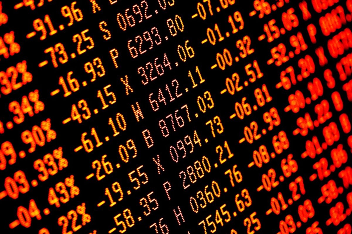 Trading screen financial data in red. Sell-off. Selective focus. Focus is appx central. Heavy selling.