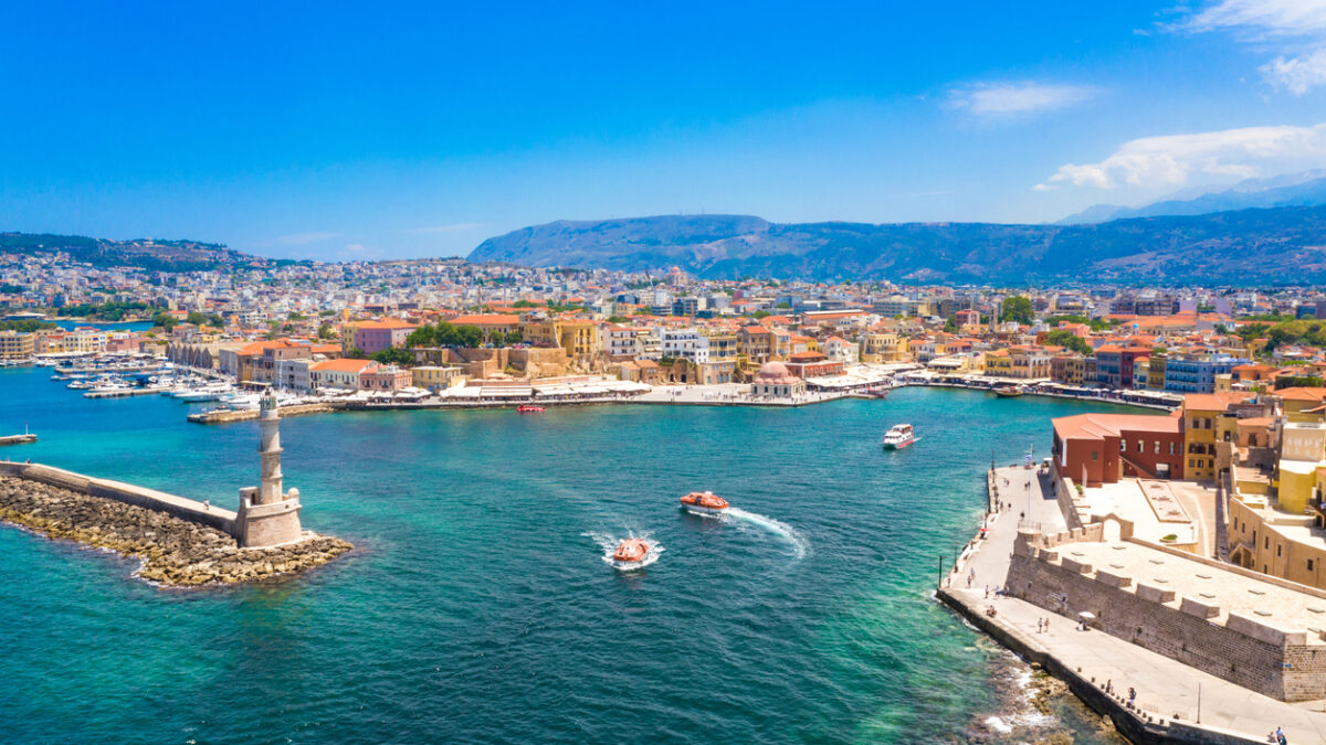 Aerial view of the beautiful city of Chania with it's old harbor and the famous lighthouse, Crete, Greece.