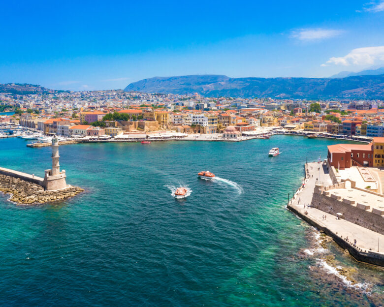 Aerial view of the beautiful city of Chania with it's old harbor and the famous lighthouse, Crete, Greece.