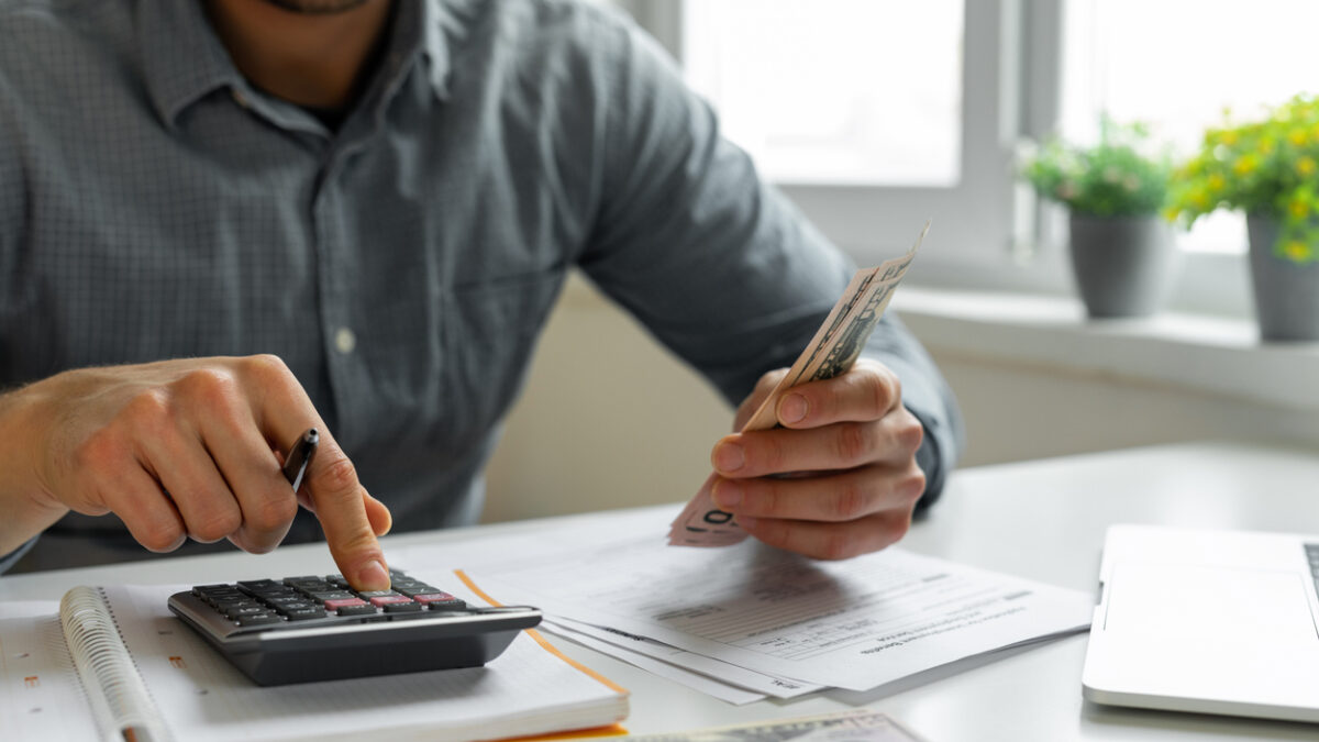 Man using calculator
