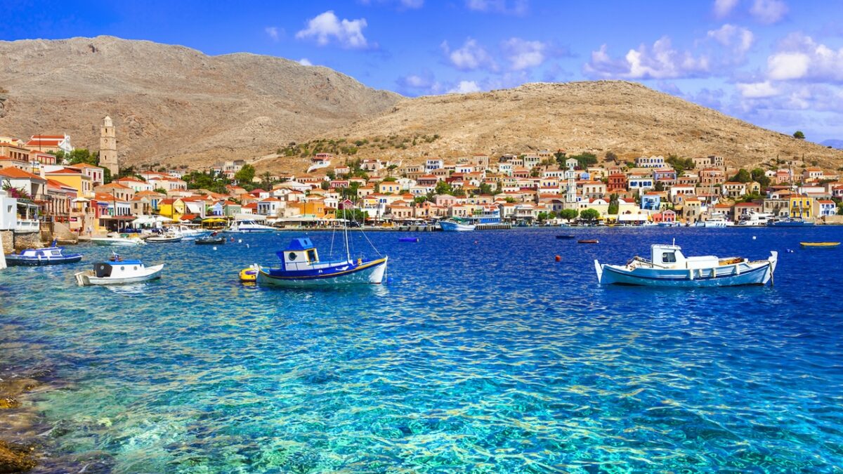 Traditional Greece fishing villages - charming Chalki (Halki) island in Dodecanese. view with typical boats and colorful houses