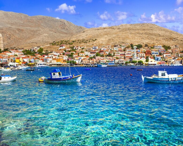 Traditional Greece fishing villages - charming Chalki (Halki) island in Dodecanese. view with typical boats and colorful houses