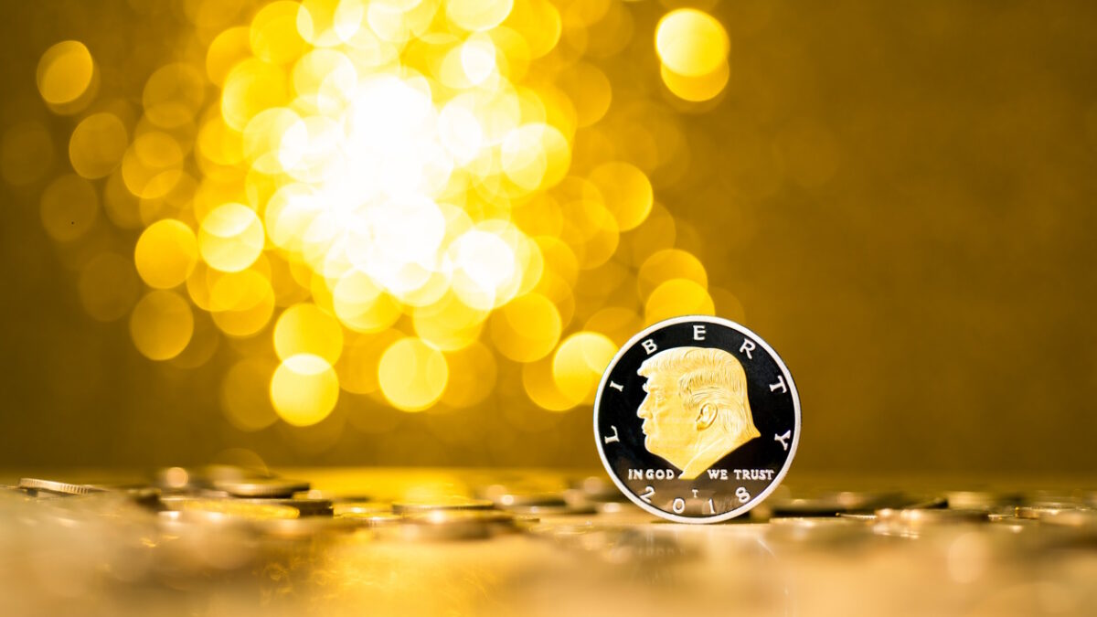 Fujian, China - December 28, 2021: Coin with Donald Trump on shiny background.Donald Trump is the 45th president of the United States