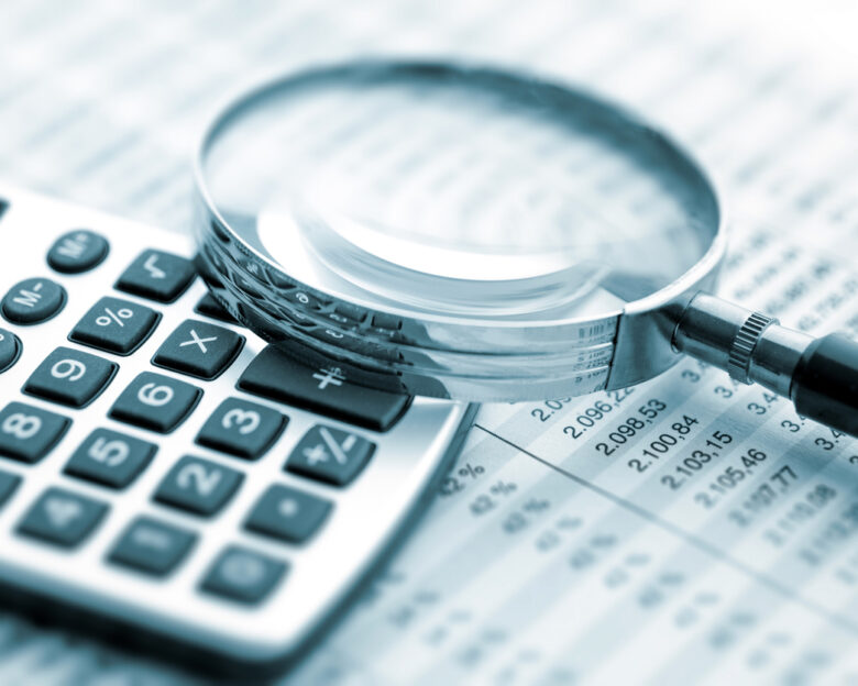 Magnifying glass on financial chart