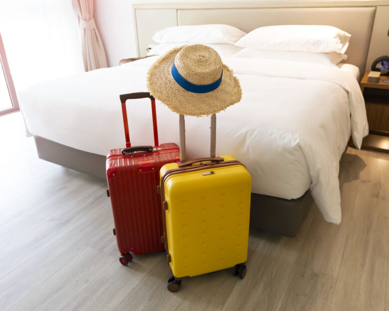 The travel with a colors luggage as business trip in a Holiday image of city building background, journey holiday concept