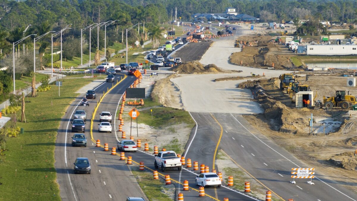 Driving traffic cars on road under construction. Building traffic infrastructure on American roadway with moving cars. SSUCv3H4sIAAAAAAAACoxSPW/kIBDtI+U/rKizkg2OvU6b6orrrotSjIFbo2XB4iOnKNr/nsGYhI3uTumYN28+3jzebm92OzKBV5w87N5ShLHSOvrgIChrEG7uNtxJI6SrkRfH+qYGQNWRFCpYp0DX4ASBzwbOEkETtU7wZU0SHyBEL321i59jCNL5YPkJYVaxOQR5xPZX/KLlKce7kliTWIEp8sOIpC/ttS2VR8UpZR+twWTkq/qSziP/0e+XA+MX63D7VPOXnj+V51JrMNJG/9k0P54/jneUhr8mMZdKppNaQj7KU6aS0x88yXmVvZEgCmWrM7xYDtp/ORioBRxc1S1OcWWOFWLDvHpcOnEbTXBpK0IpLeKItnaBSScTf+MkWfAZvMcKUfDaLzy6PVejjA2rLJK7EoGGprBl7HCgLe27tmPj2NyzjZD/x6ywz7pR2TEu2oKQaeiHPV9/Tjt0bGDDOPSZURxNFp0VMr9RfehbulVf/VrkKPGfX0to3wwoaKT3q/lboUojSTc2kote7gWd2L6TIPbjQKf9oaPt0PRAGQxYdXkHAAD//wMA/mDfAKwDAAA=