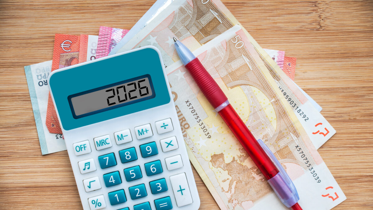 2026 numbers on a calculator and euros banknotes, new year finance, money and budget concept