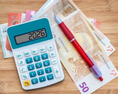 2026 numbers on a calculator and euros banknotes, new year finance, money and budget concept