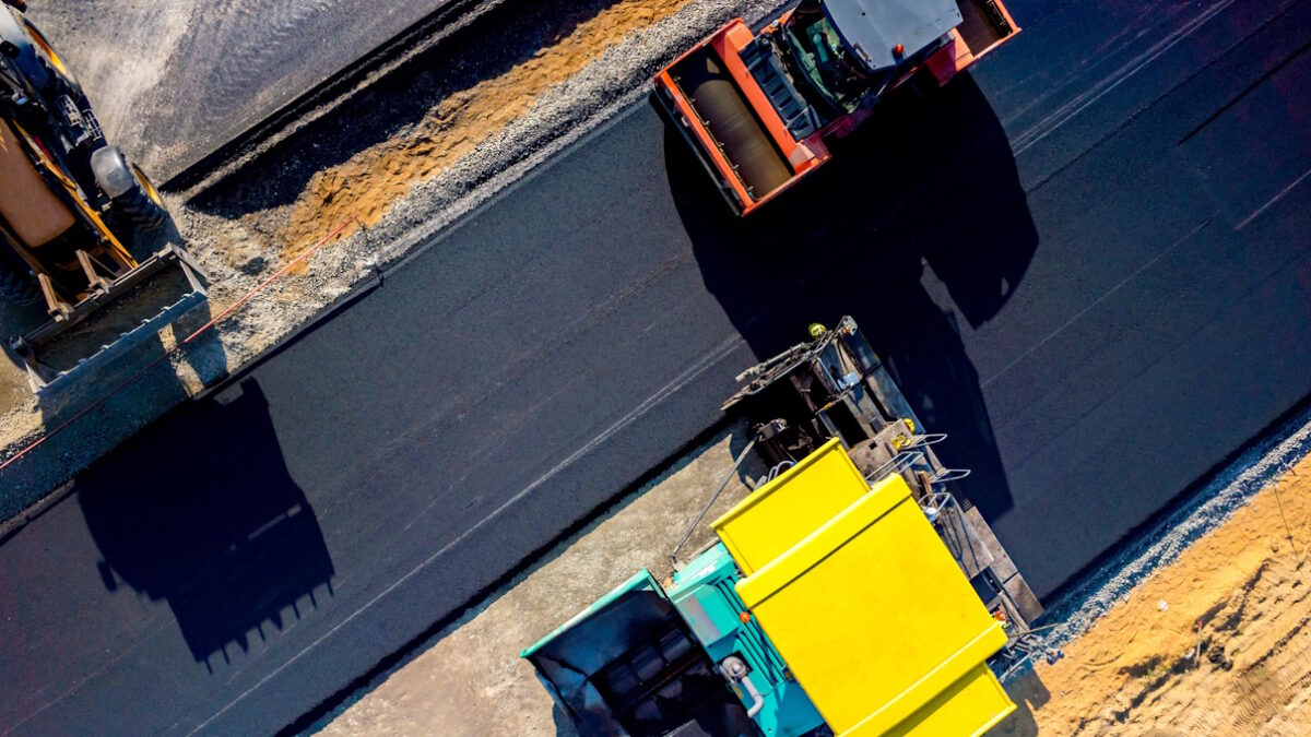 Aerial view on the new asphalt road under construction