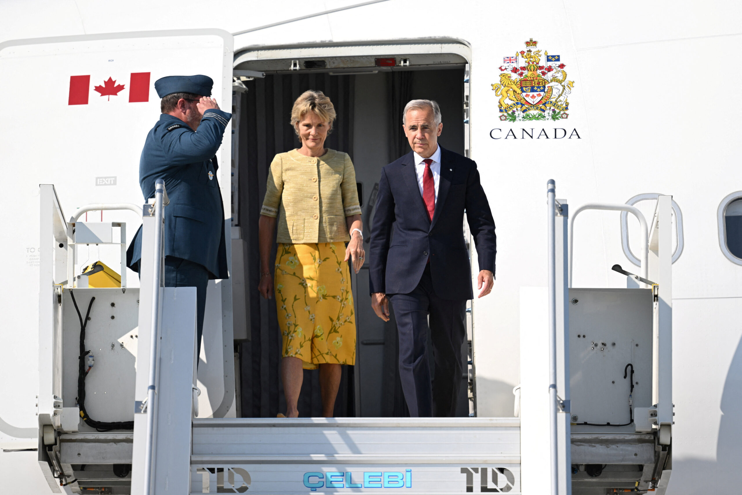 NATO leaders’ Summit in Ankara ANKARA, TURKIYE - JULY 07: Canadian Prime Minister Mark Carney (R) and his wife, Diana Fox Carney (L), arrive at Ankara Airport to attend the 36th NATO Heads of State and Government Summit in Ankara, Turkey, on July 07, 2026. Muhammed Abdullah Kurtar/Pool via REUTERS