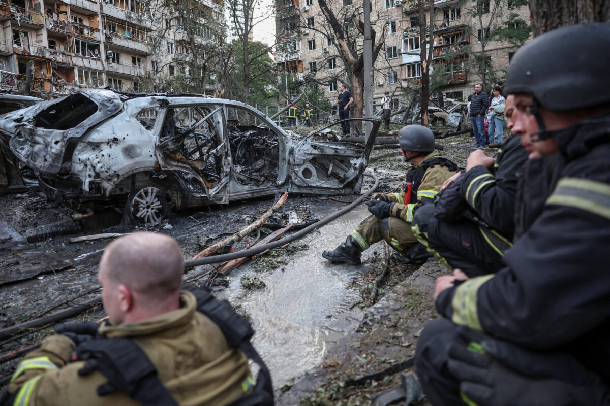 Firefighters take a break as they work at a site of a Russian missile and drone strikes, amid Russia’s attack on Ukraine, in Kyiv, Ukraine, July 2, 2026. REUTERS