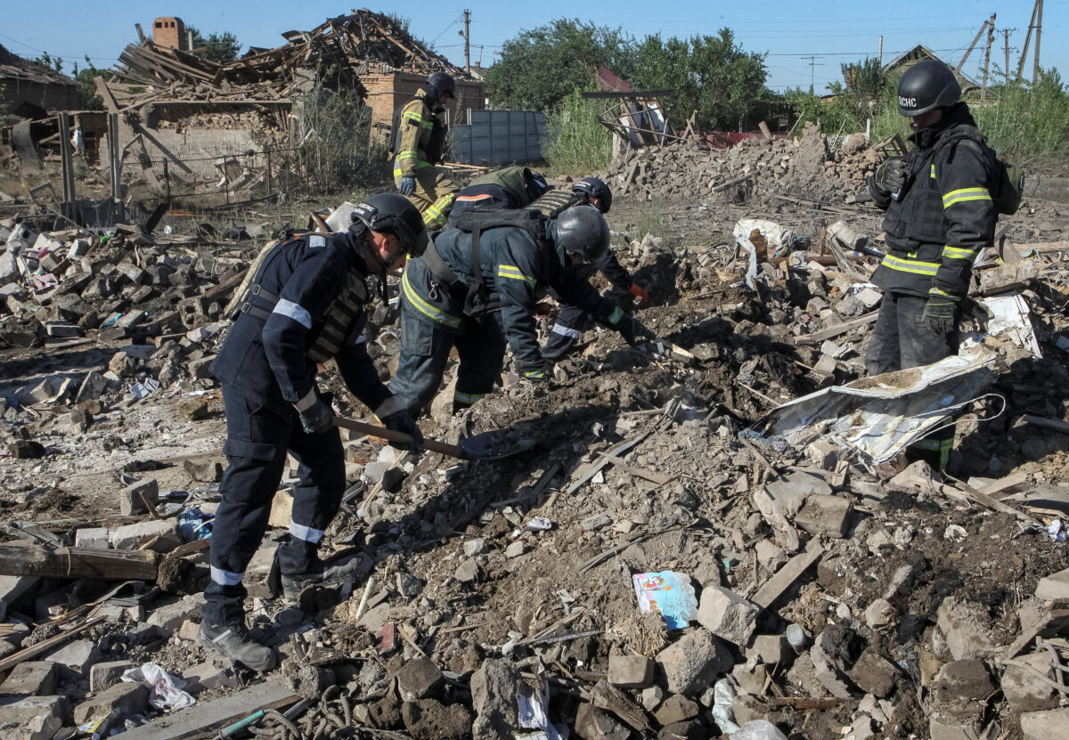 Rescuers work at the site of houses hit by a Russian missile strike, amid Russia's attack on Ukraine, in the village of Radushne near the city of Kryvyi Rih, Dnipropetrovsk region, Ukraine July 30, 2026. REUTERS