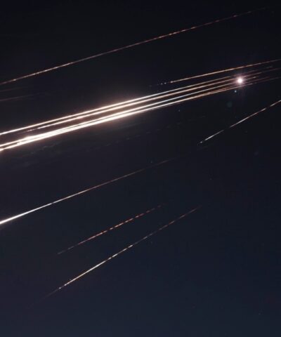 Missiles illuminate the night sky during an Iranian missile attack in Jerusalem, early Sunday, June 15, 2025.