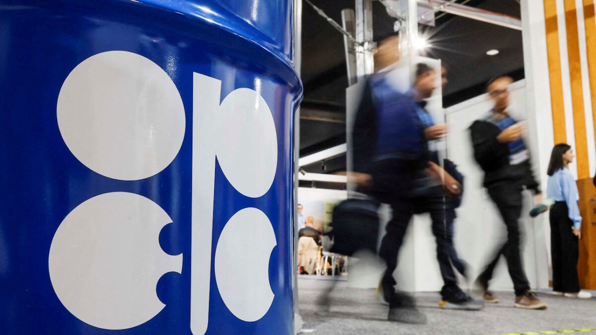 FILE PHOTO: People walk past an installation depicting barrel of oil with the logo of Organization of the Petroleum Exporting Countries (OPEC) in Baku, Azerbaijan November 19, 2024.