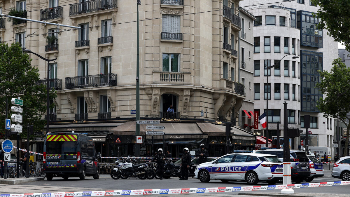 Police stand guard after a knife attack near the Porte de Clichy in Paris, France July 27, 2026. REUTERS/Abdul Saboor