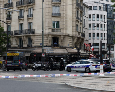 Police stand guard after a knife attack near the Porte de Clichy in Paris, France July 27, 2026. REUTERS/Abdul Saboor