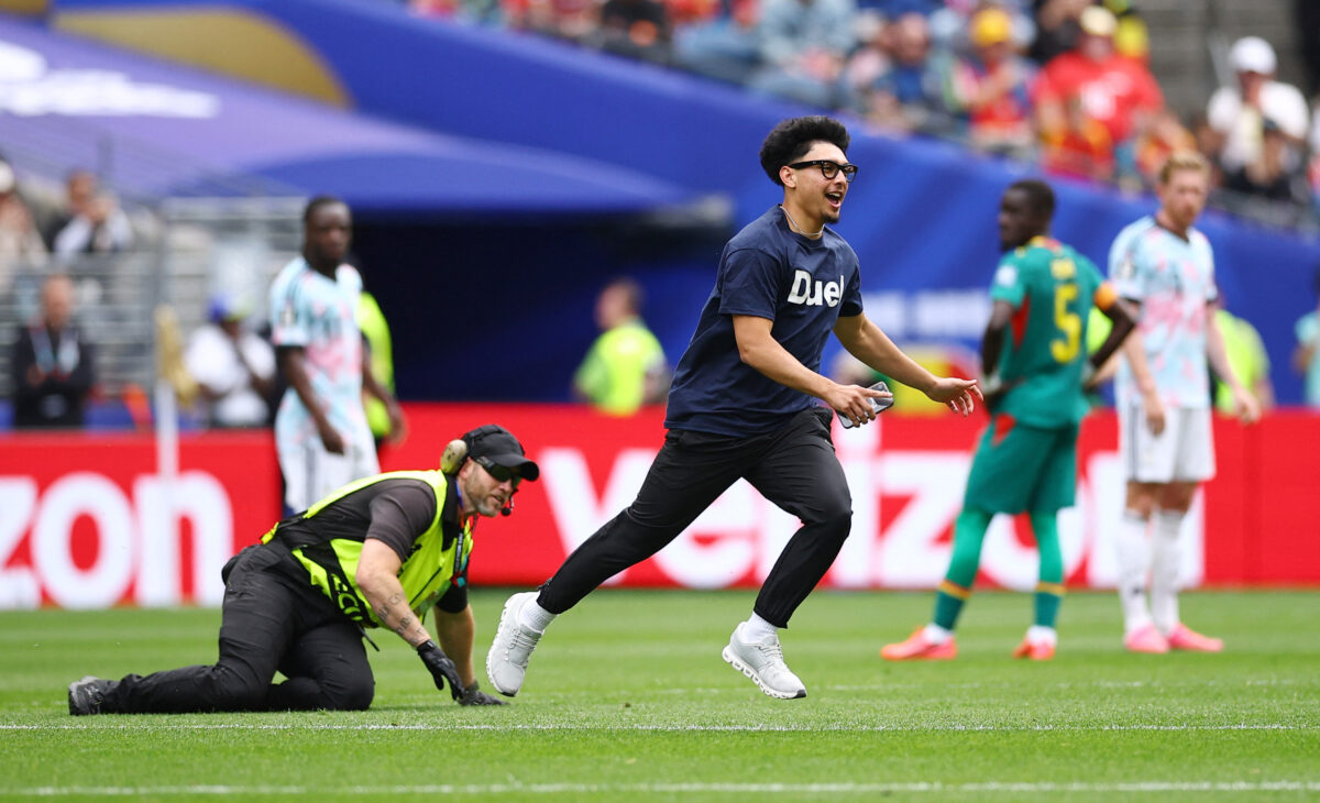 Soccer Football - FIFA World Cup 2026 - Round of 32 - Belgium v Senegal - Seattle Stadium, Seattle, Washington, U.S. - July 1, 2026 A pitch invader interrupts the match REUTERS