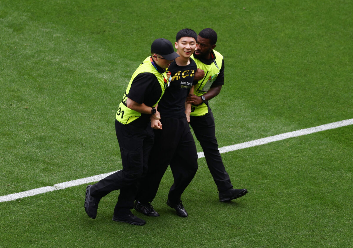 Soccer Football - FIFA World Cup 2026 - Round of 32 - Belgium v Senegal - Seattle Stadium, Seattle, Washington, U.S. - July 1, 2026 General view as a pitch invader is detained by stewards during the match REUTERS