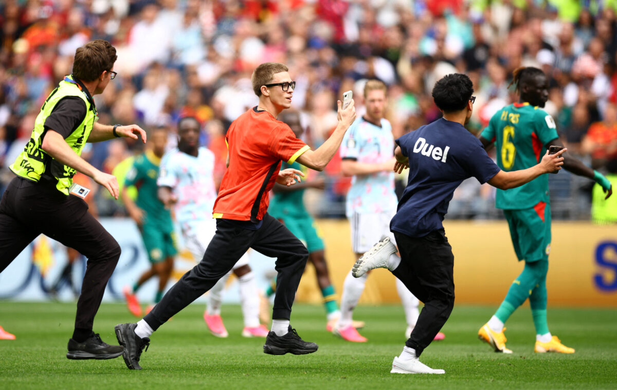 Soccer Football - FIFA World Cup 2026 - Round of 32 - Belgium v Senegal - Seattle Stadium, Seattle, Washington, U.S. - July 1, 2026 Pitch invaders interrupt the match REUTERS