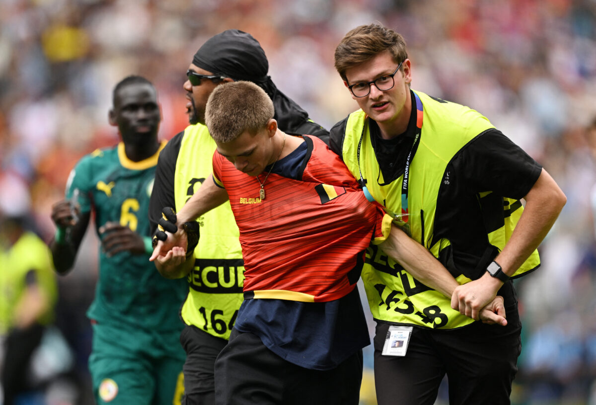 Soccer Football - FIFA World Cup 2026 - Round of 32 - Belgium v Senegal - Seattle Stadium, Seattle, Washington, U.S. - July 1, 2026 A pitch invader is removed by stewards IMAGN IMAGES via Reuters
