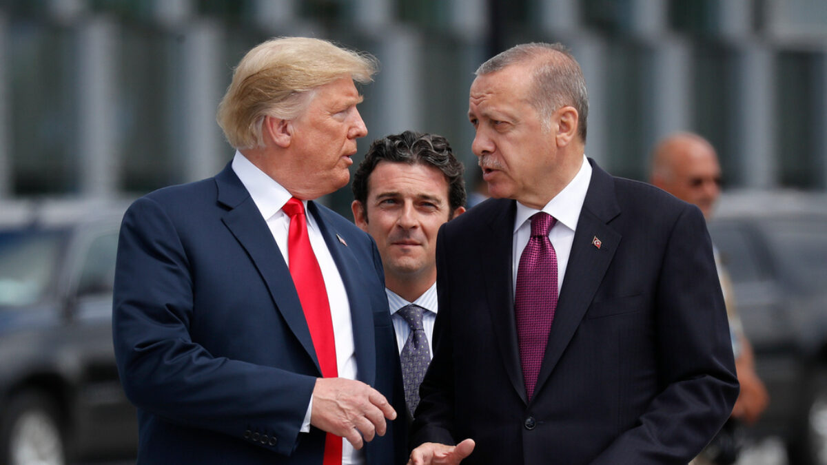 FILE - President Donald Trump, left, talks with Turkey's President Recep Tayyip Erdogan at a summit of heads of state and government at NATO headquarters in Brussels, July 11, 2018.