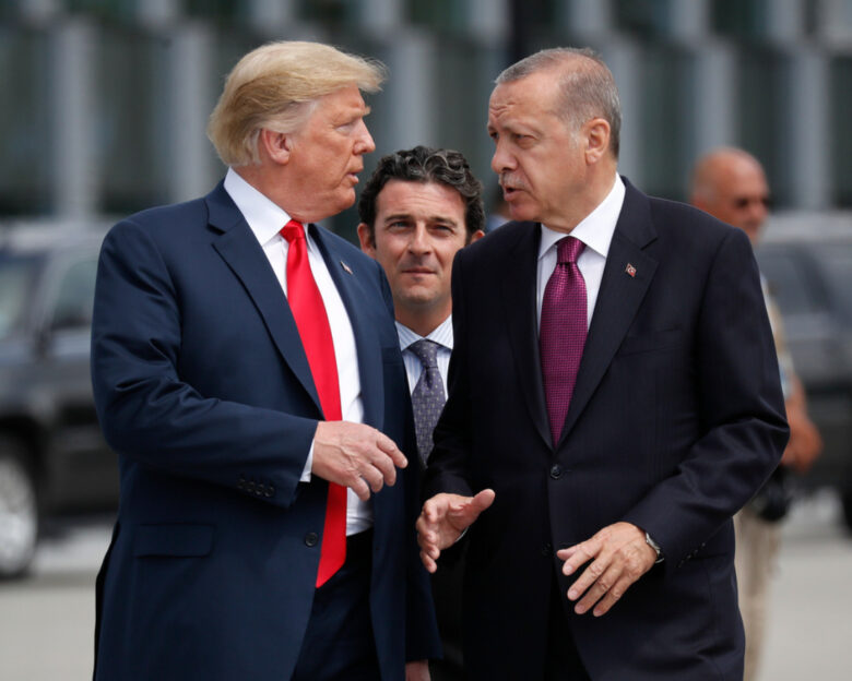 FILE - President Donald Trump, left, talks with Turkey's President Recep Tayyip Erdogan at a summit of heads of state and government at NATO headquarters in Brussels, July 11, 2018.