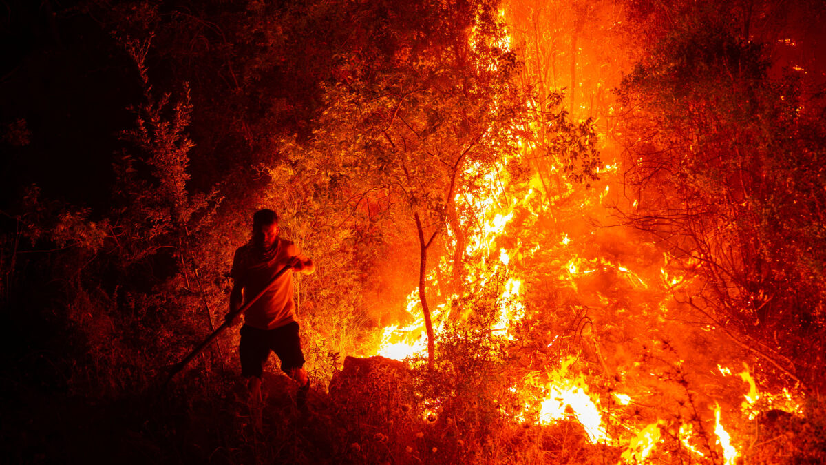 A villager helps battle a wildfire in the Seydikemer district of Mugla province, Turkey, July 29, 2026. REUTERS/Ali Dinc