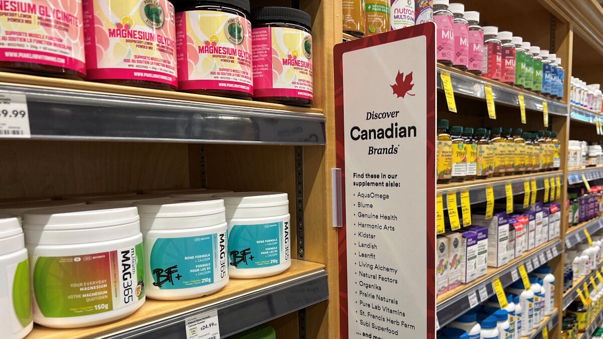 A sign invites customers to choose Canadian products in a health supplements aisle at a Whole Foods store in Vancouver, British Columbia, Canada July 20, 2026. Picture taken with a mobile phone.