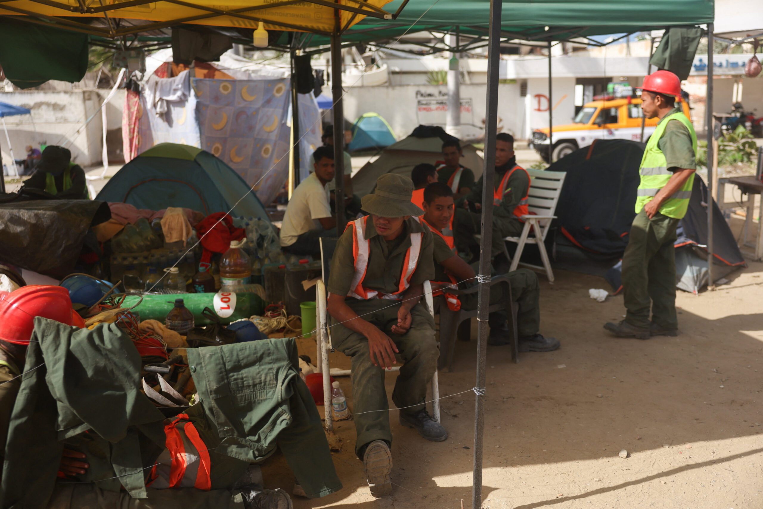 Members of the Venezuelan Army rest inside a makeshift camp set up to assist in the aftermath of the June 24 earthquakes, in La Guaira, Venezuela, July 16, 2026. REUTERS