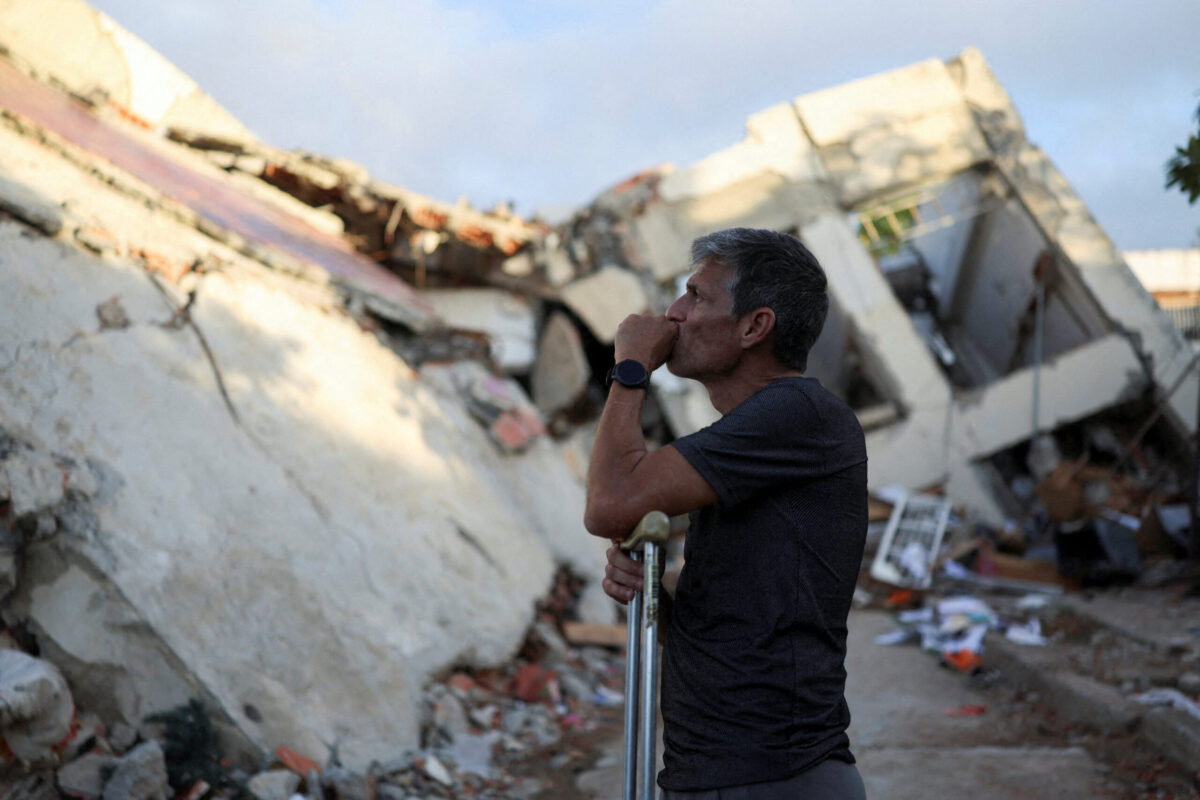 Francisco Soto, a survivor of the June 24 earthquakes, reacts at the place where his apartment was located, as he returns to look for documents and other valuables, in La Guaira, Venezuela July 12, 2026. REUTERS