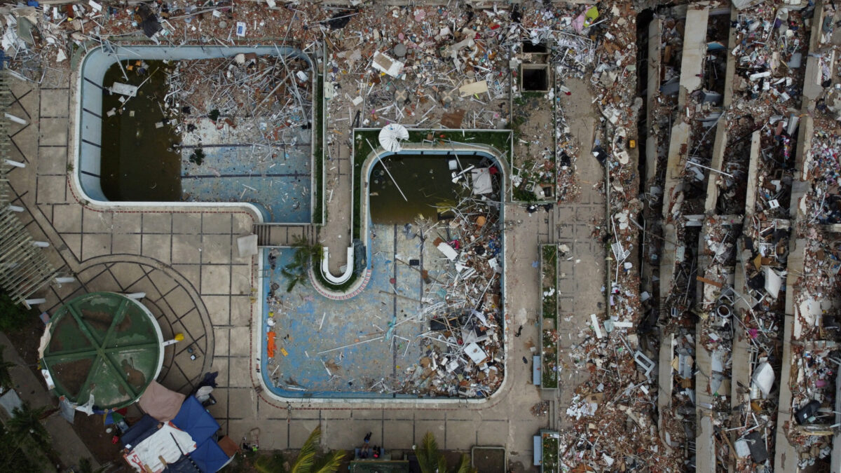 A drone view shows a pool surrounded by debris in the aftermath of the June 24 earthquakes in Tanaguarena, La Guaira, Venezuela, July 12, 2026. REUTERS