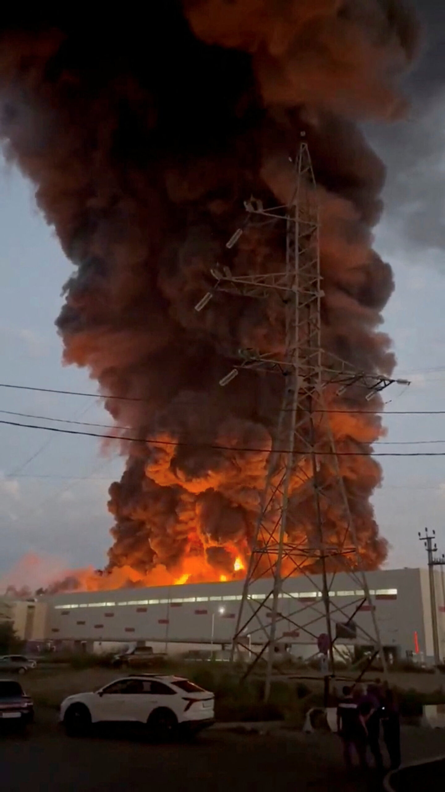 Smoke rises from a Wildberries warehouse on fire after an attack in Nevinnomyssk, Russia, July 22, 2026, in this still image obtained from social media video. Social Media/via REUTERS THIS IMAGE HAS BEEN SUPPLIED BY A THIRD PARTY. NO RESALES. NO ARCHIVES. NEWS USE ONLY. TPX IMAGES OF THE DAY. VERIFICATION: - Building exterior, utility poles and towers, and road layout matched archive and satellite imagery. - Corroborating footage showed smoke rising from the same location. - The governor of Stavropol region Vladimir Vladimirov said on Telegram on July 22 that a drone attack on the outskirts of Nevinnomyssk resulted in fire in a warehouse complex. - Tatyana Kim, the head and co-founder of Wildberries, posted on Telegram on July 22 that the company’s logistic centers in Krasnodar and Nevinnomyssk were attacked. - No older versions of the video found posted online before July 22.