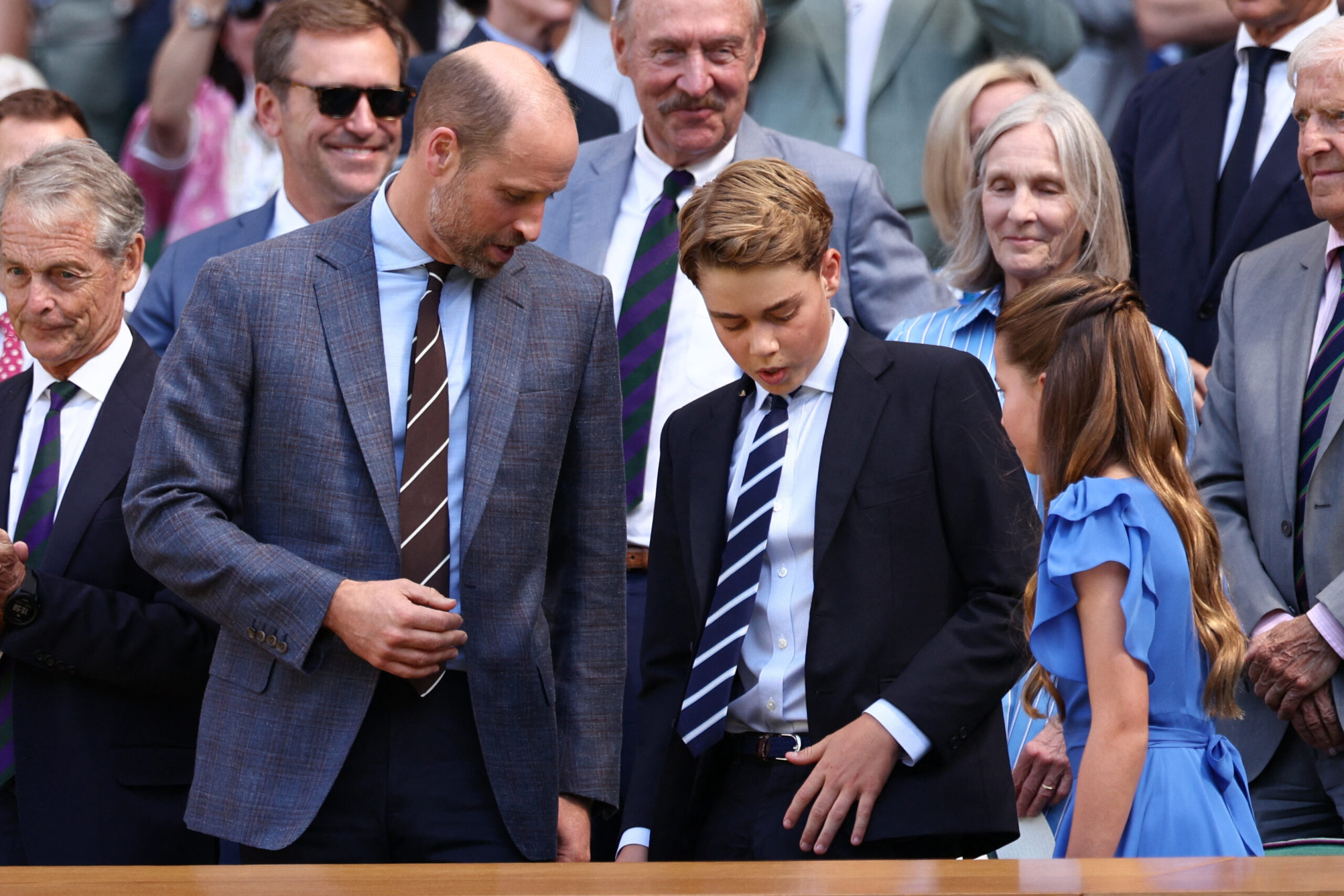 Wimbledon Tennis - Wimbledon - All England Lawn Tennis and Croquet Club, London, Britain - July 12, 2026 Britain's William, Prince of Wales, Princess Charlotte, and Prince George in the Royal Box ahead of the final match between Italy's Jannik Sinner and Germany's Alexander Zverev REUTERS/Marko Djurica