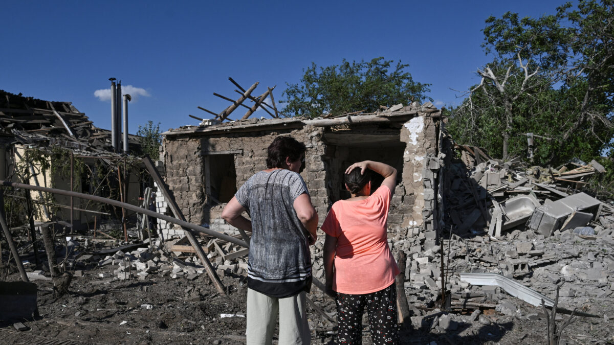 Women react while they look at houses damaged by a Russian air strike, amid Russia's attack on Ukraine, in Zaporizhzhia, Ukraine, July 13, 2026. REUTERS/Stringer