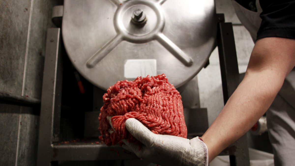 Butcher Brett Marley holds the freshly ground beef at Casey's Market in Western Springs, Illinois, April 25, 2012. "We're seeing customers in here that we haven't seen in ages," said store manager Joe Lane. Lane is not alone in laboring harder than ever to meet consumers' demands for ground beef free of the ammonia hydroxide-treated filler that roiled the beef industry this spring due to health concerns even though there have been no reported cases of illness due to its consumption. Picture taken April 25, 2012.