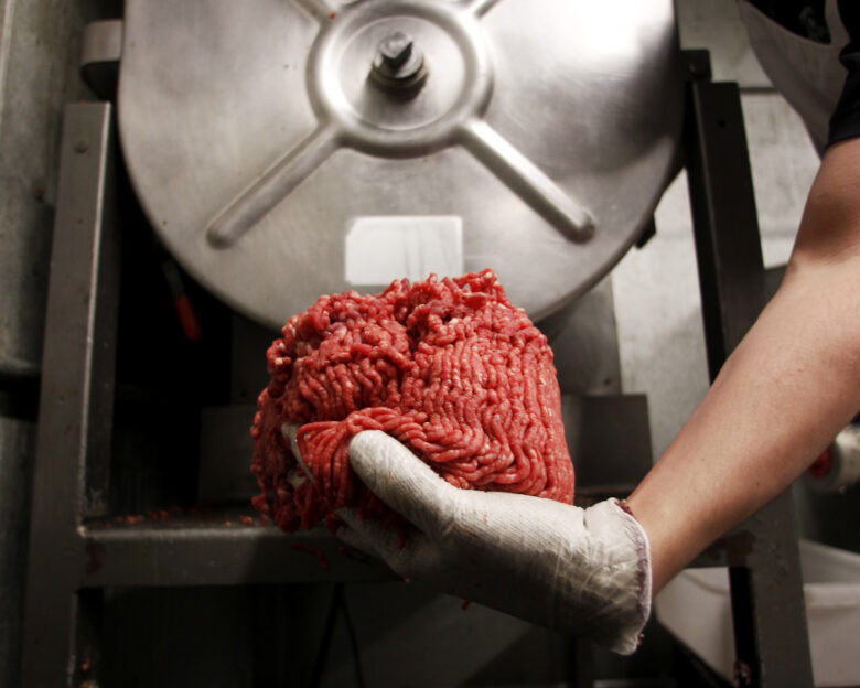 Butcher Brett Marley holds the freshly ground beef at Casey's Market in Western Springs, Illinois, April 25, 2012. "We're seeing customers in here that we haven't seen in ages," said store manager Joe Lane. Lane is not alone in laboring harder than ever to meet consumers' demands for ground beef free of the ammonia hydroxide-treated filler that roiled the beef industry this spring due to health concerns even though there have been no reported cases of illness due to its consumption. Picture taken April 25, 2012.