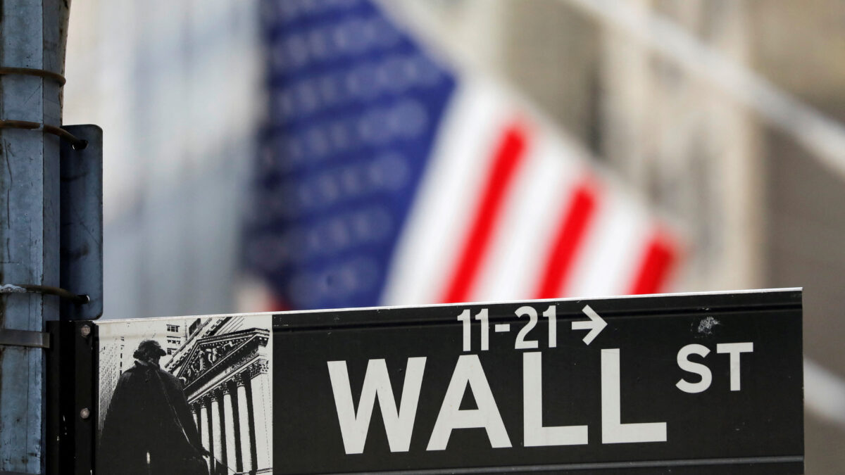 FILE PHOTO: A street sign for Wall Street is seen outside the New York Stock Exchange (NYSE) in New York City, New York, U.S., July 19, 2021.