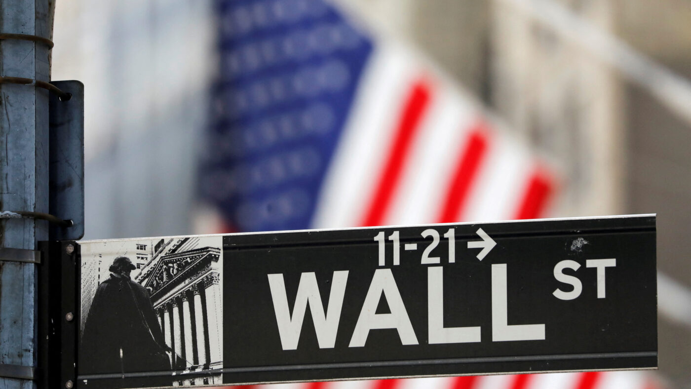 FILE PHOTO: A street sign for Wall Street is seen outside the New York Stock Exchange (NYSE) in New York City, New York, U.S., July 19, 2021.