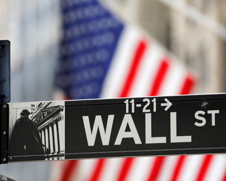 FILE PHOTO: A street sign for Wall Street is seen outside the New York Stock Exchange (NYSE) in New York City, New York, U.S., July 19, 2021.