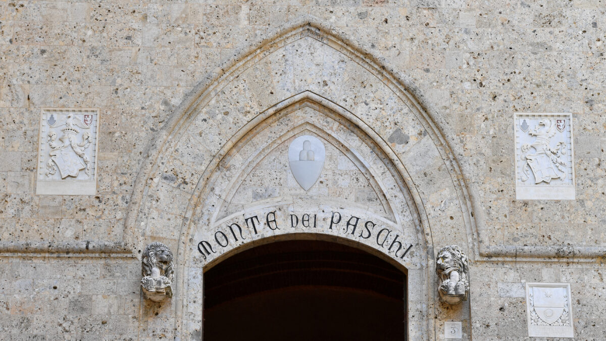 FILE PHOTO: FILE PHOTO: View of the entrance to the headquarters of Monte dei Paschi di Siena (MPS), the oldest bank in the world, which is facing massive layoffs as part of a planned corporate merger, in Siena, Italy, August 11, 2021.
