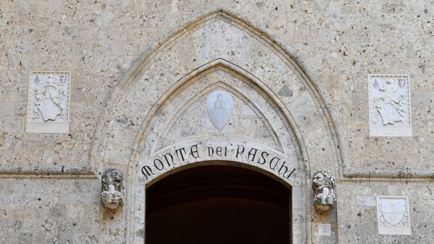 FILE PHOTO: FILE PHOTO: View of the entrance to the headquarters of Monte dei Paschi di Siena (MPS), the oldest bank in the world, which is facing massive layoffs as part of a planned corporate merger, in Siena, Italy, August 11, 2021.