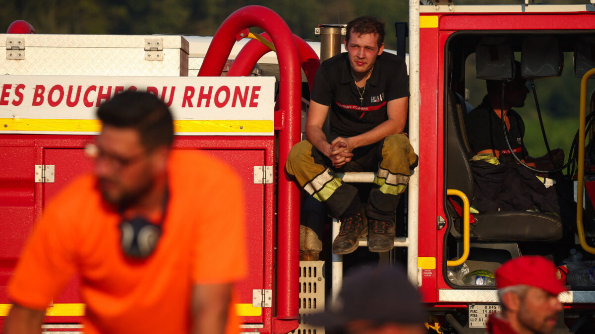 Firefighters rest in a fire truck as they battle a wildfire near Montfort-sur-Argens, near Correns, in the Var department, amid worsening drought conditions following a heatwave and water shortages across much of France, August 1, 2026.