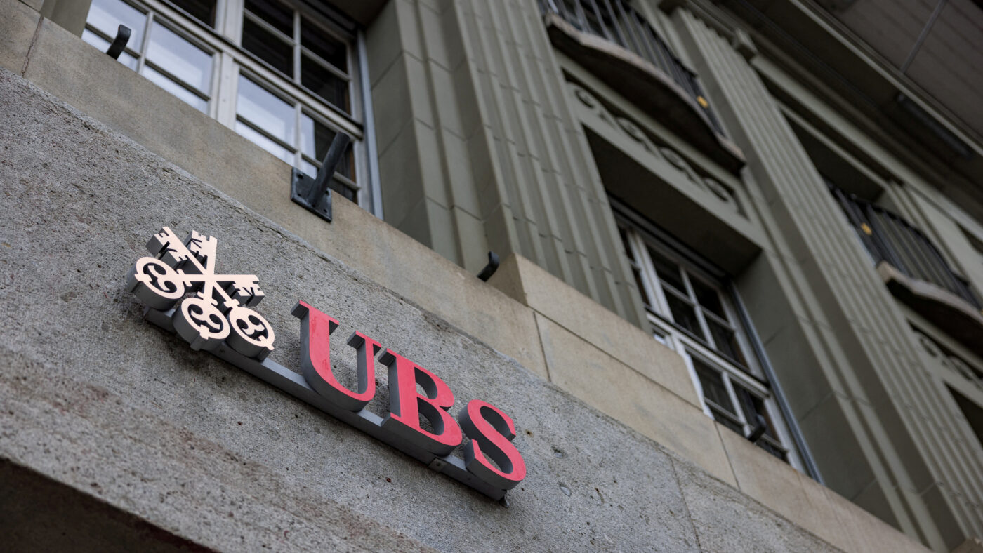 FILE PHOTO: The UBS logo is pictured on a building next to the Federal Palace of Switzerland, in Bern, Switzerland, December 11, 2025.