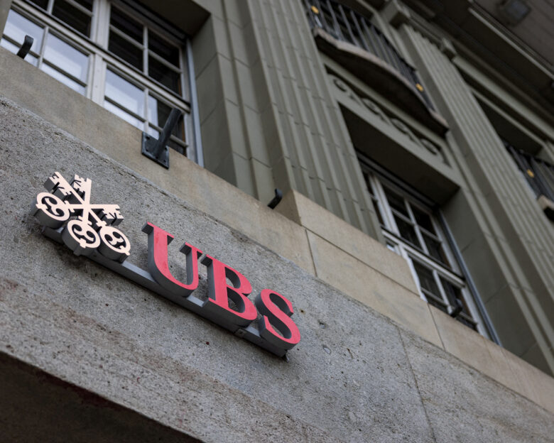 FILE PHOTO: The UBS logo is pictured on a building next to the Federal Palace of Switzerland, in Bern, Switzerland, December 11, 2025.
