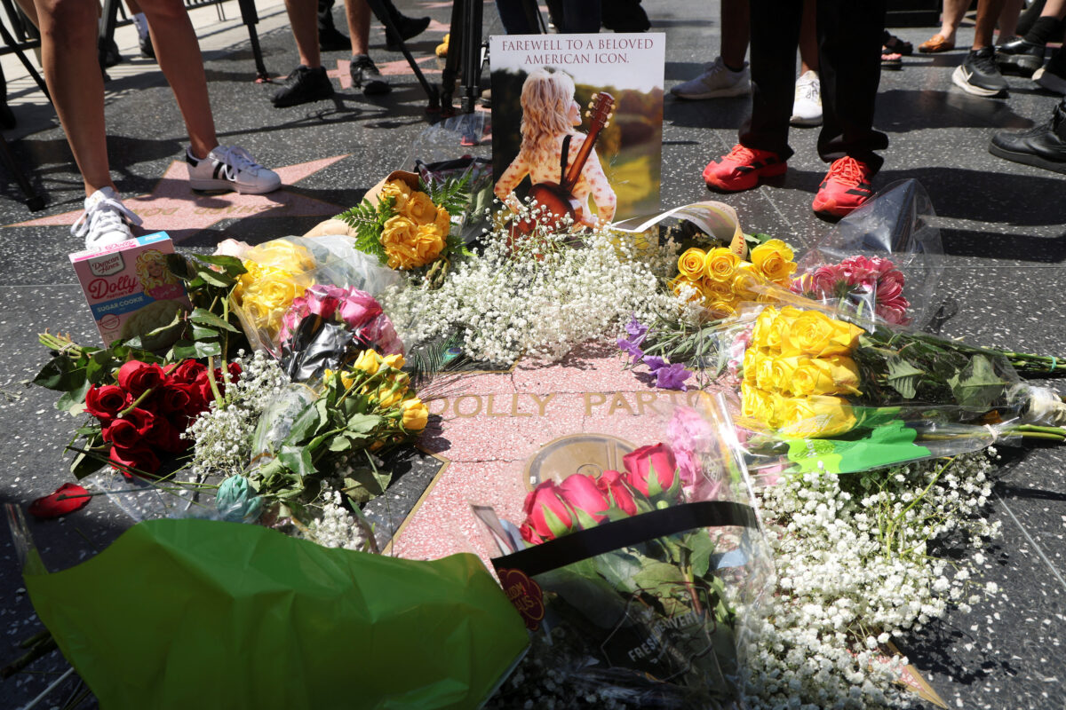 Flowers lie at the star of Dolly Parton on the Hollywood Walk of Fame after it was announced that the country music icon died aged 80, in Los Angeles, California, U.S., August 25, 2026. REUTERS