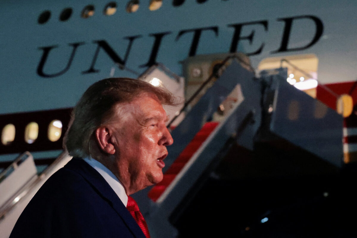 U.S. President Donald Trump speaks to members of the media after disembarking Air Force One at Joint Base Andrews, Maryland, U.S., August 11, 2026. REUTERS/Kylie Cooper