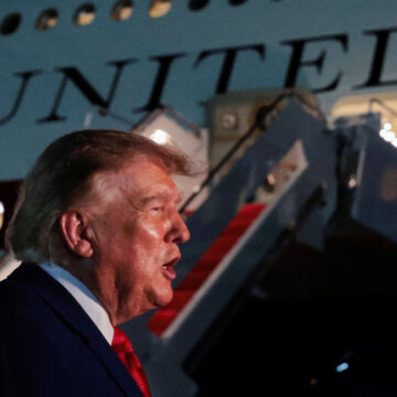 U.S. President Donald Trump speaks to members of the media after disembarking Air Force One at Joint Base Andrews, Maryland, U.S., August 11, 2026. REUTERS/Kylie Cooper