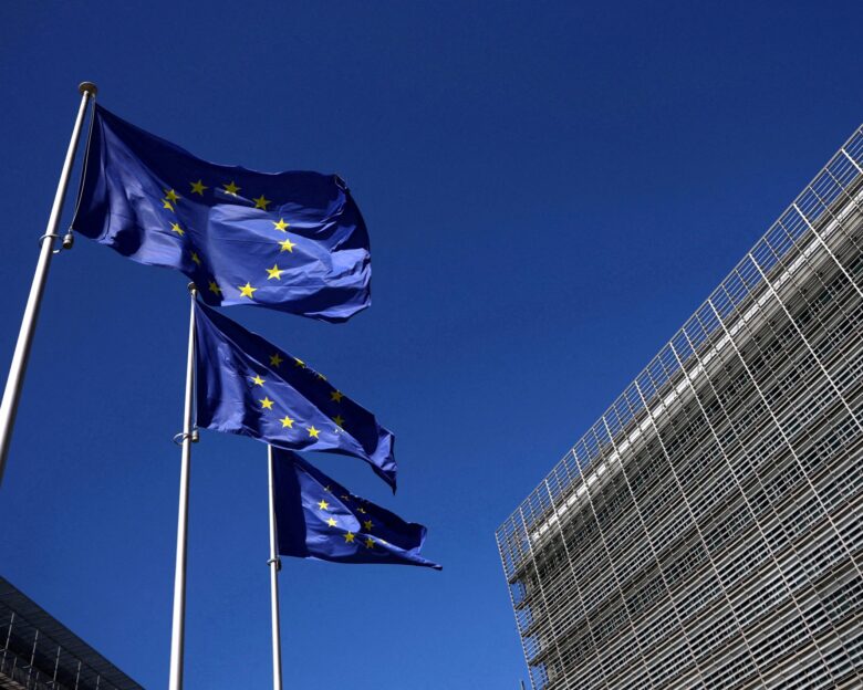 FILE PHOTO: European Union flags flutter outside the European Commission headquarters in Brussels, Belgium