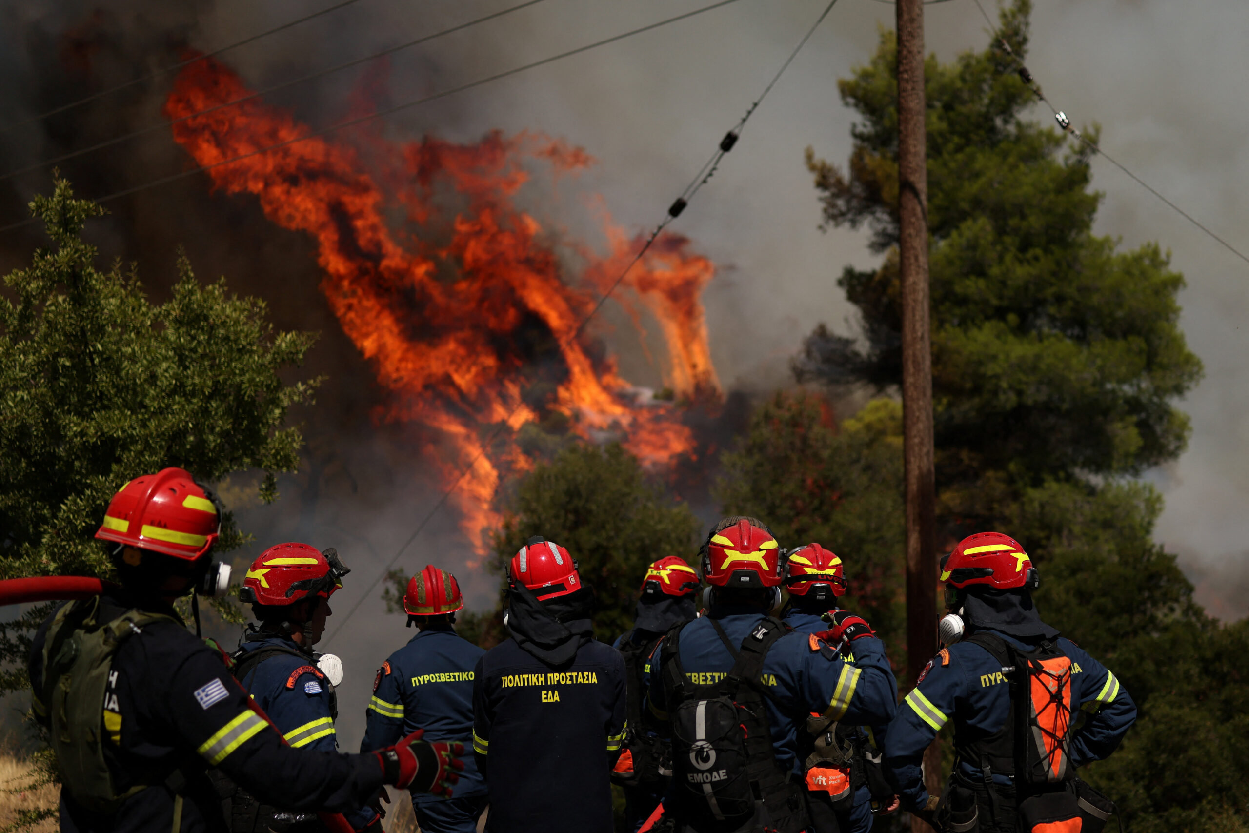 Wildfire burns near Agia Paraskevi Firefighters battle wildfire near the village Agia Paraskevi, Greece, August 2, 2026. REUTERS/Stelios Misinas TPX IMAGES OF THE DAY