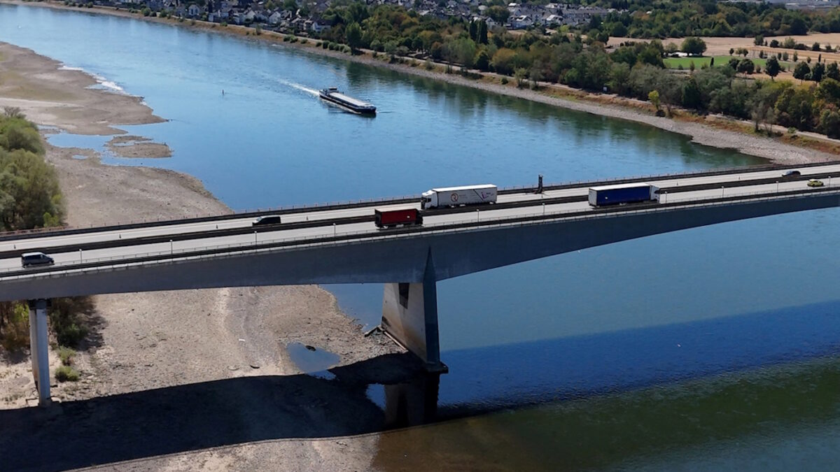 FILE PHOTO: Cars and trucks cross a bridge over the Rhine river on the Autobahn 48 highway near Bendorf, Germany, August 11, 2026, during prolonged dry weather across Europe that causes massive consequences for German industry.